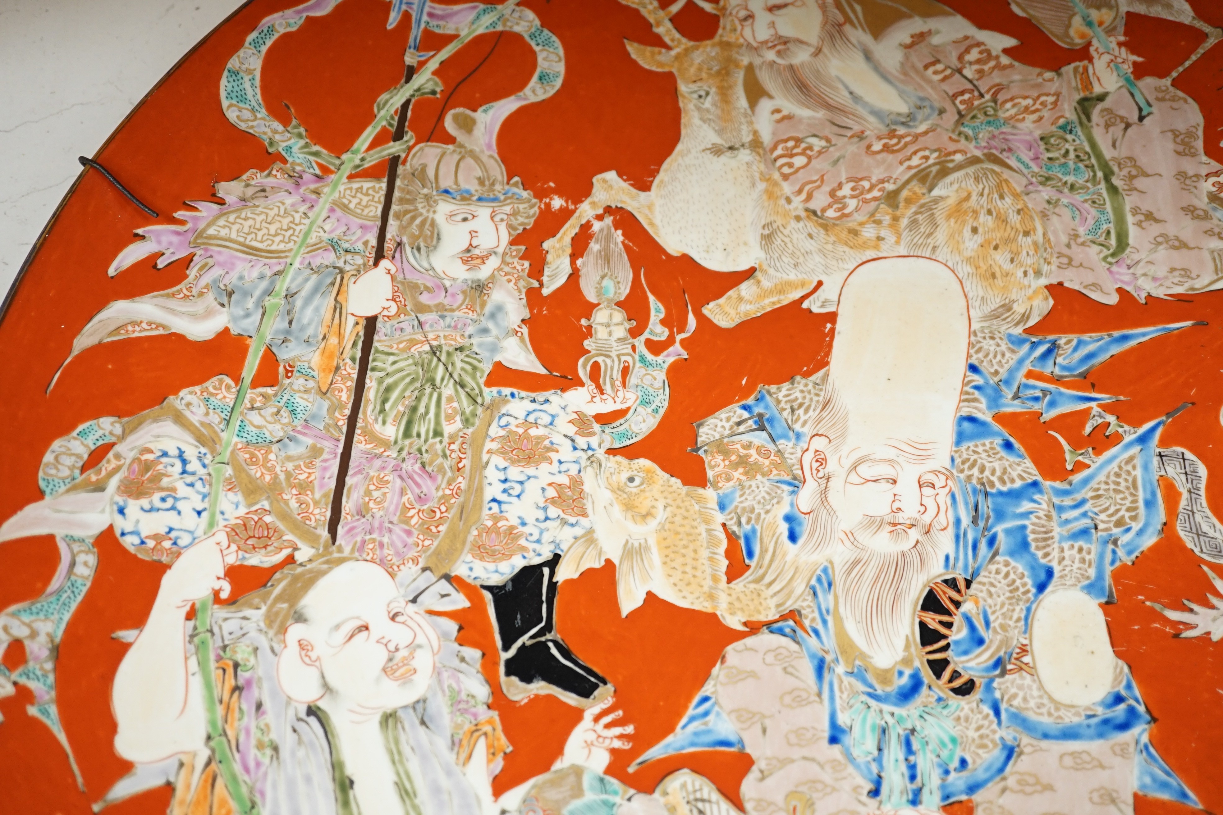 A massive Japanese Arita 'Seven Gods of Happiness' dish, Meiji period, 60.5cm.